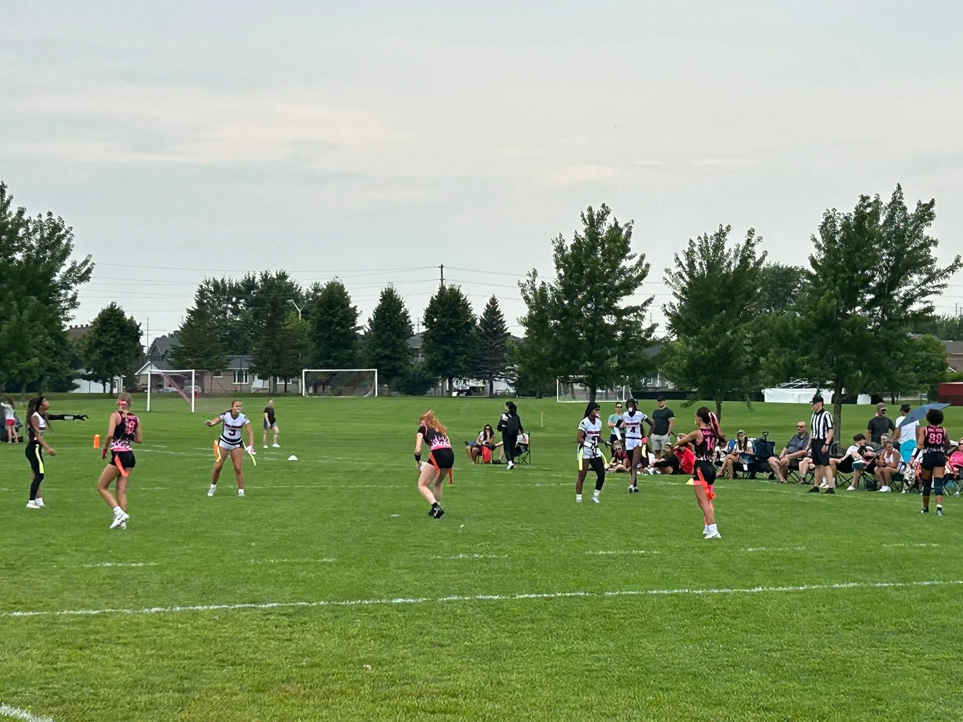 Girls running routes and working in space during a flag football game