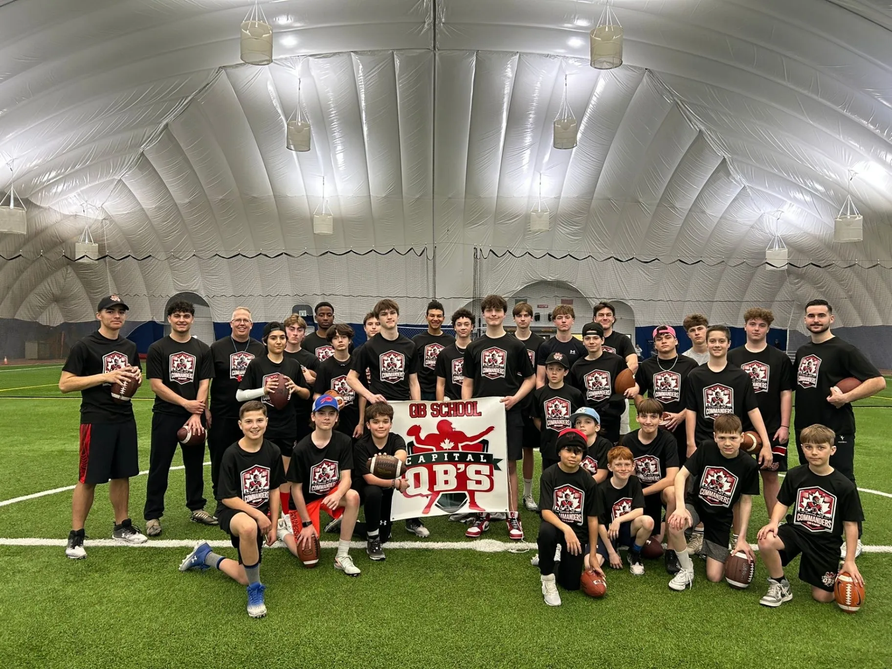 Capital QBs athletes and coaches training together inside an Ottawa football dome